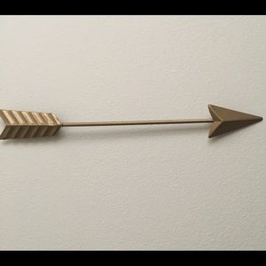 Gold metal arrow